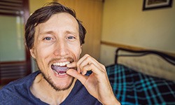 Patient in Idaho Falls putting on their ClearCorrect aligners