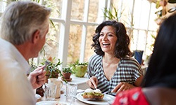 People converse over lunch