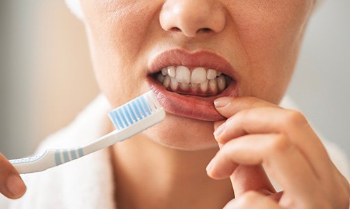 Symptoms of gum disease include bleeding when you brush or floss your teeth