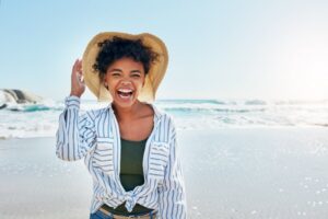 Woman smiling at the beach